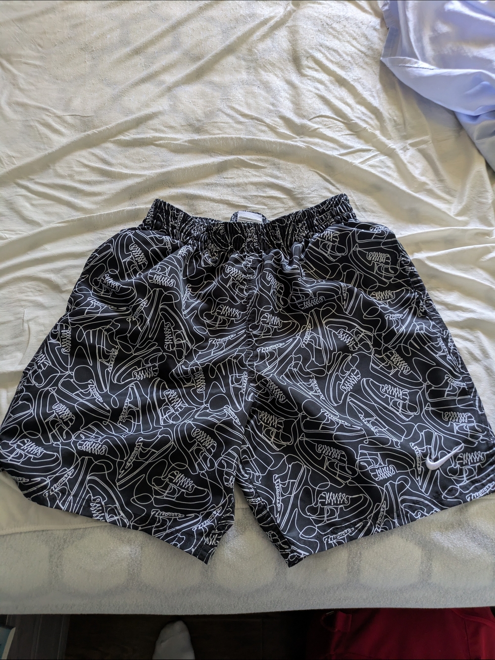 Nike Black Swim Trunks with White Shoe Outline Print